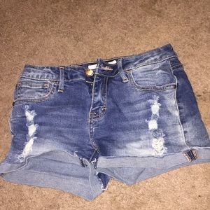 Blue jeans shorts with holes